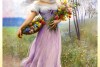 Girl In A Lilac Coloured Dress With A Bouquet Of Flowers